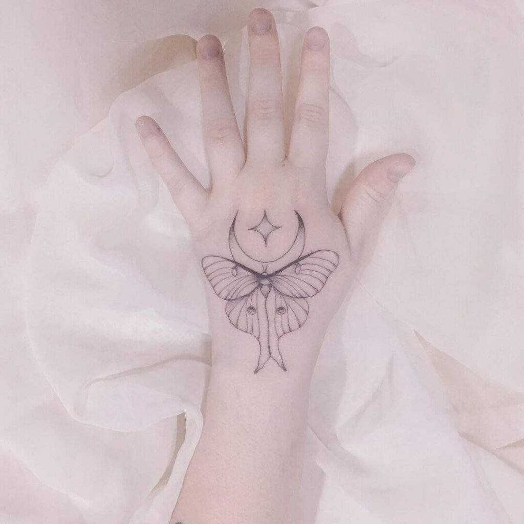 Moth moon tattoo