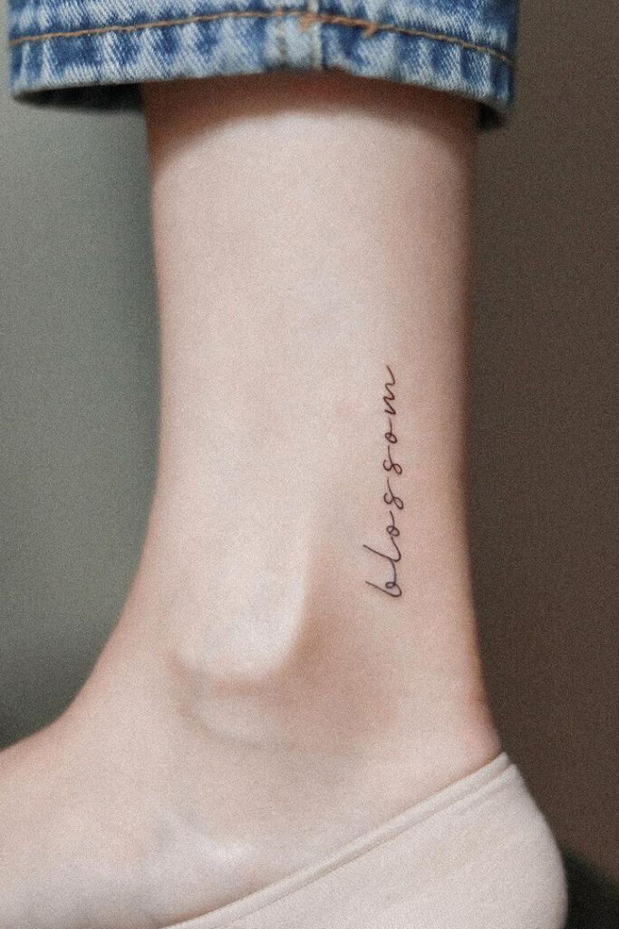 Letter ankle tattoo