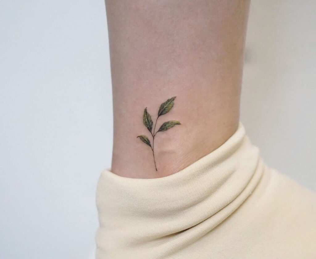 Realistic plant ankle tattoo