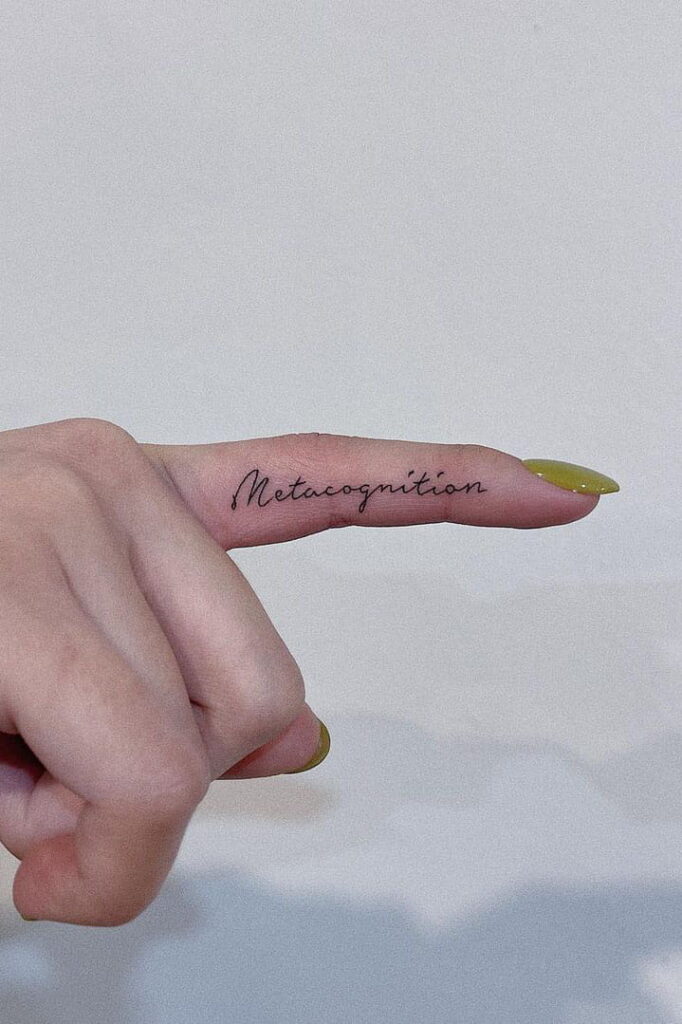 Quote tattoo on finger