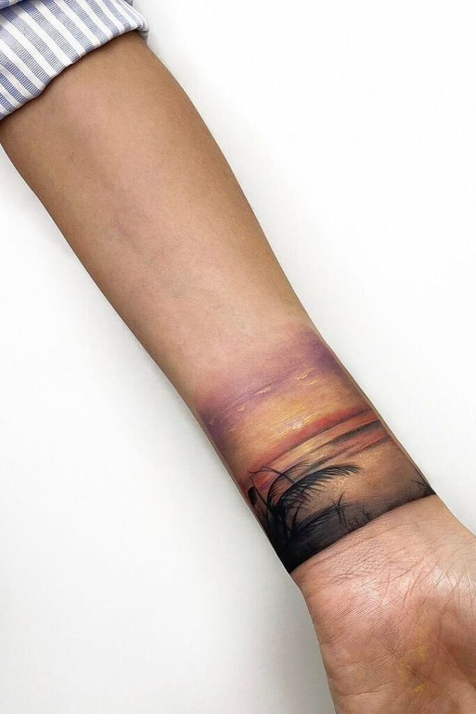 Beach sunset wrist tattoo