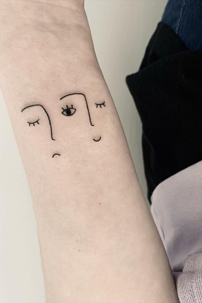 Face Wrist Tattoo