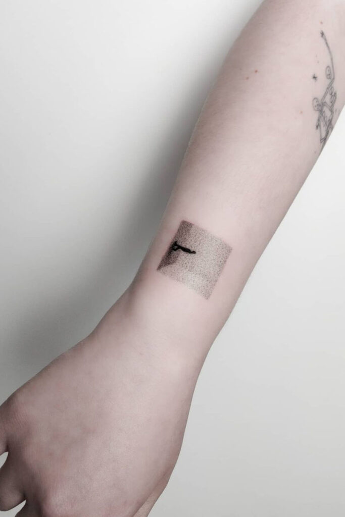 Abstract wrist tattoo