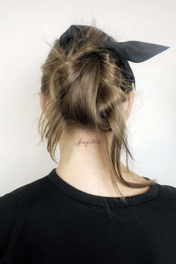 quote tattoo on back of neck