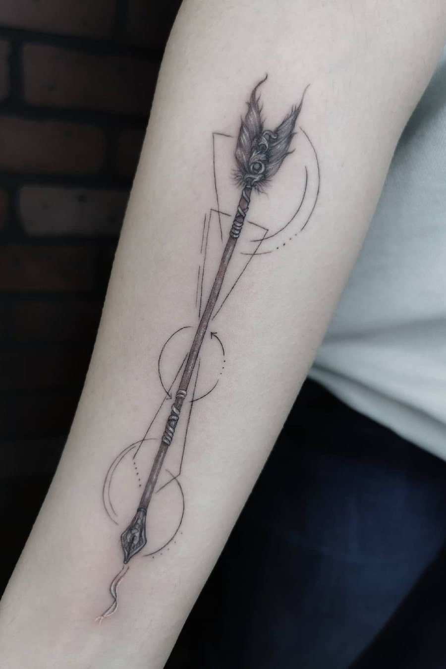 Arrow tattoo on arm