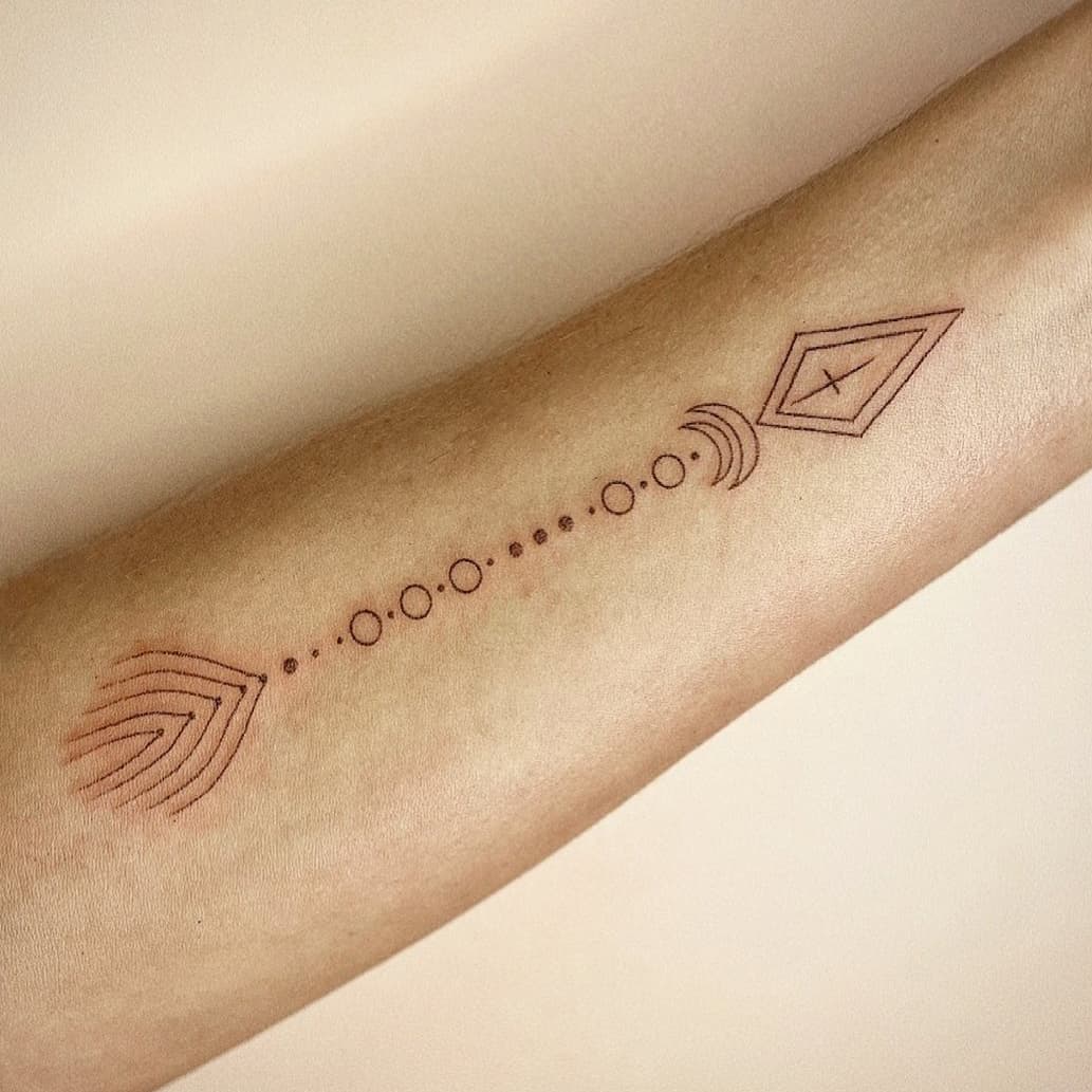 Special symbol arrow tattoo