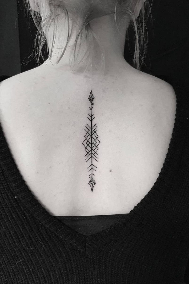 Arrow tattoo on the back