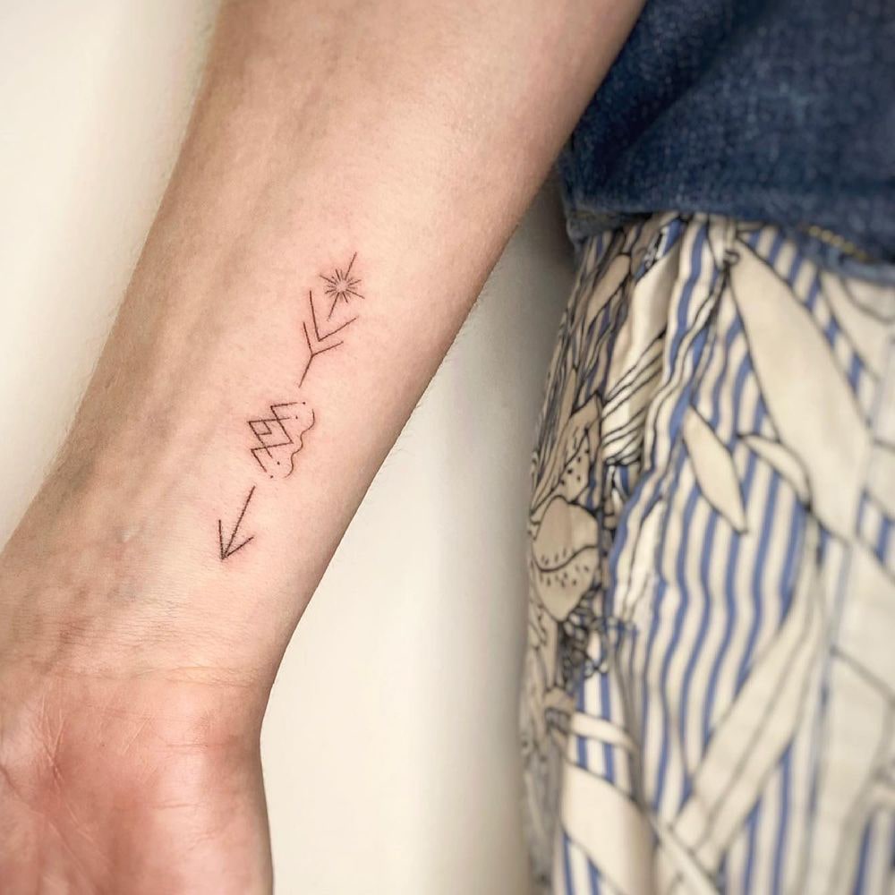 Arrow tattoo on wrist