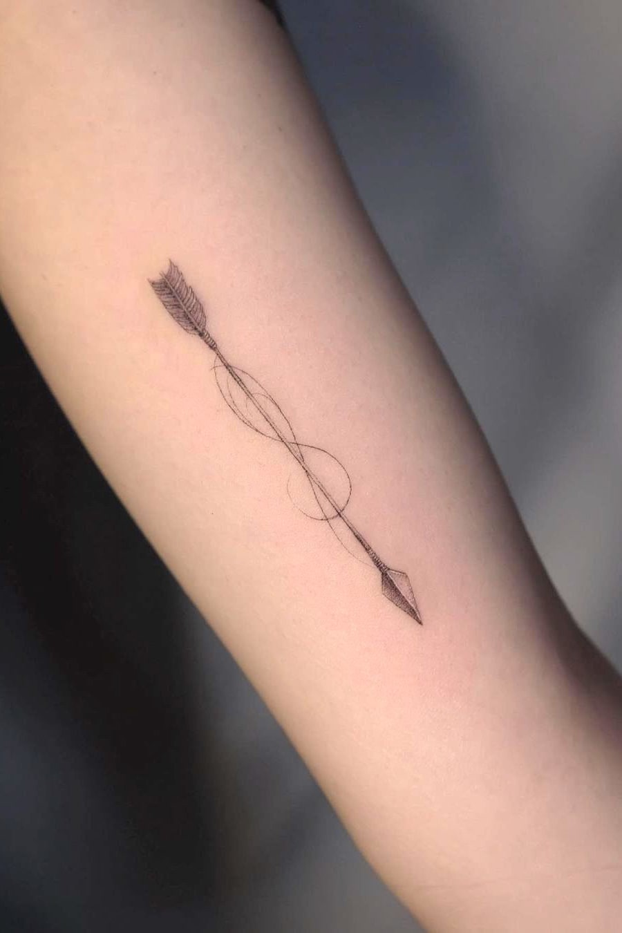 Infinity symbol arrow tattoo