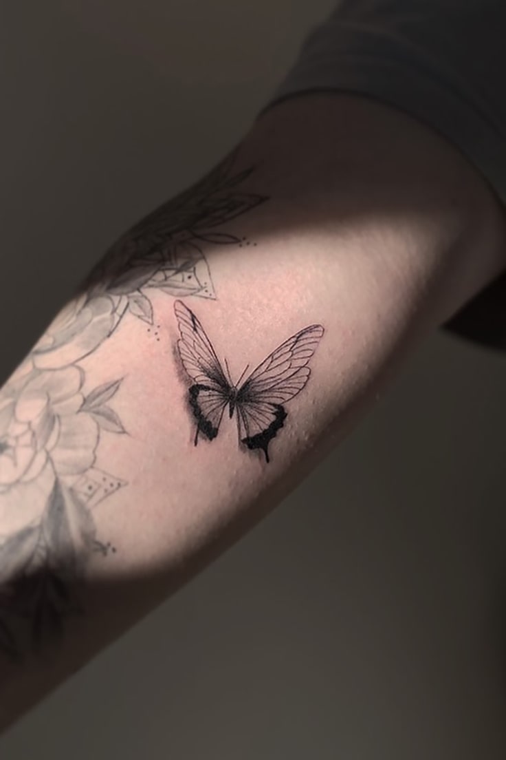 3D butterfly tattoo on arm