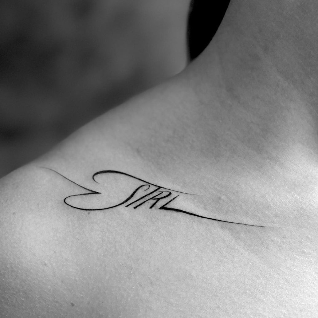 Word collarbone tattoo