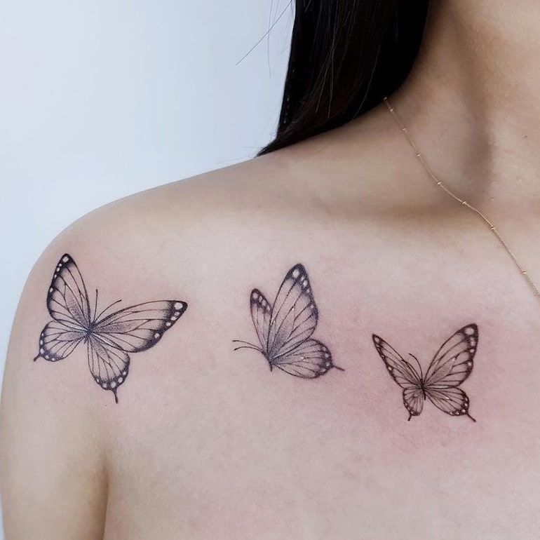 Butterfly collarbone tattoo