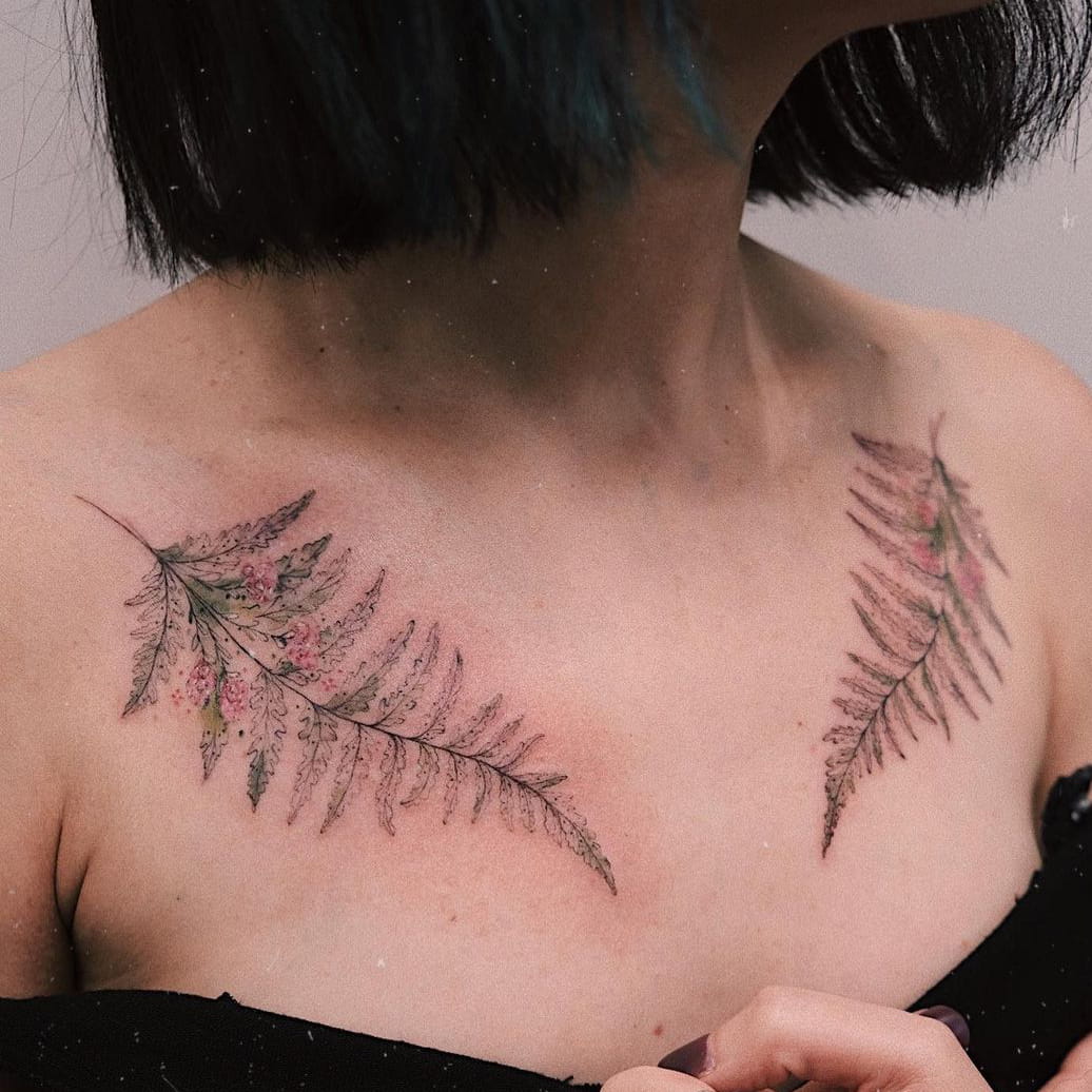 Symmetrical collarbone tattoo