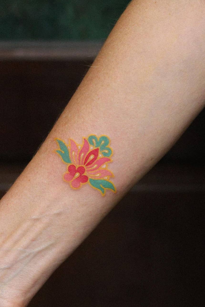 Colored lotus tattoo