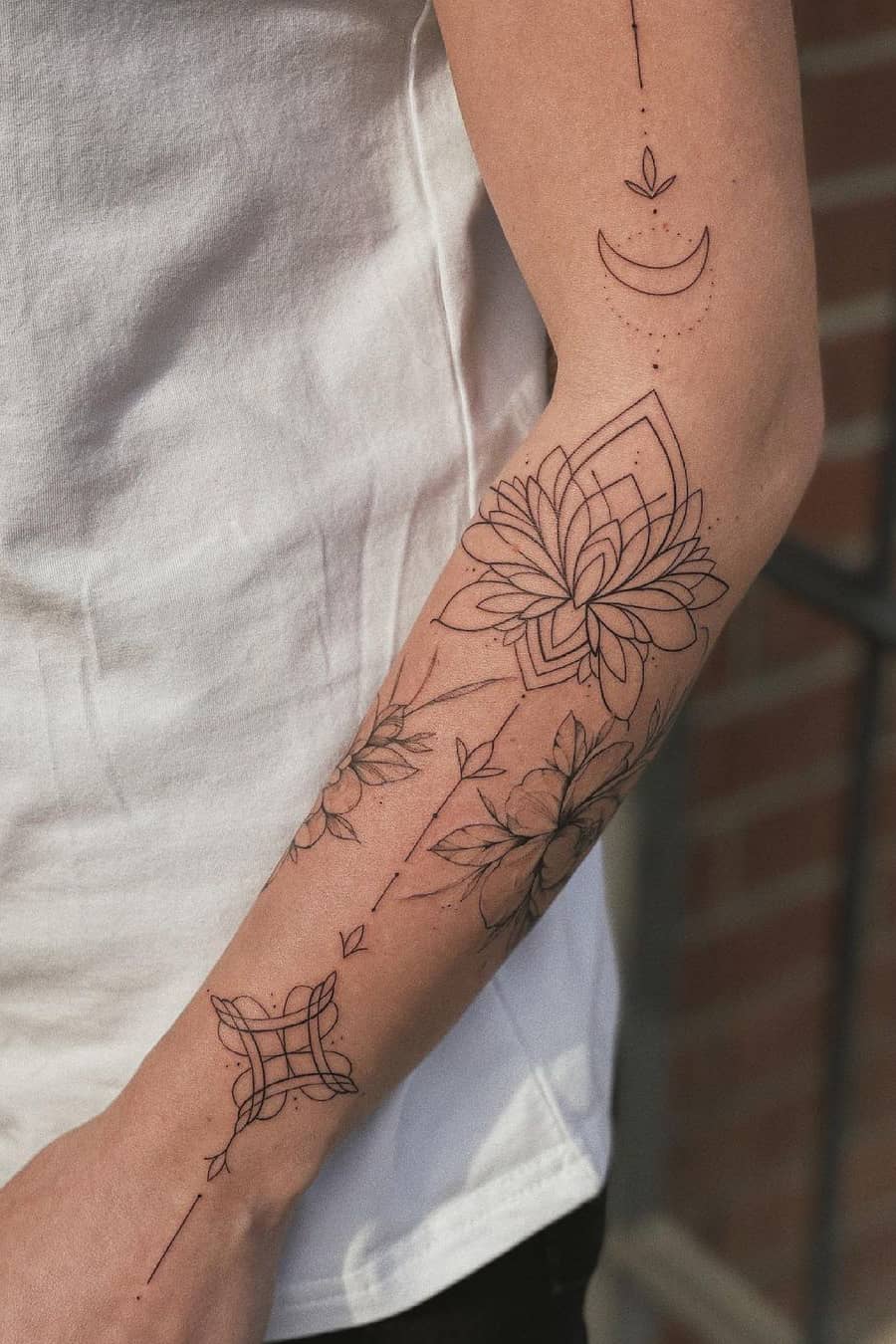 Fine line lotus tattoo