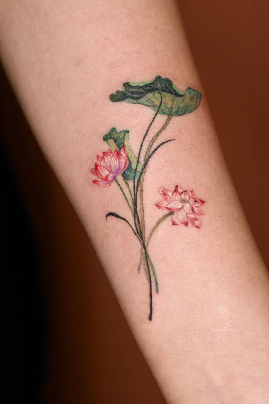 Green lotus tattoo