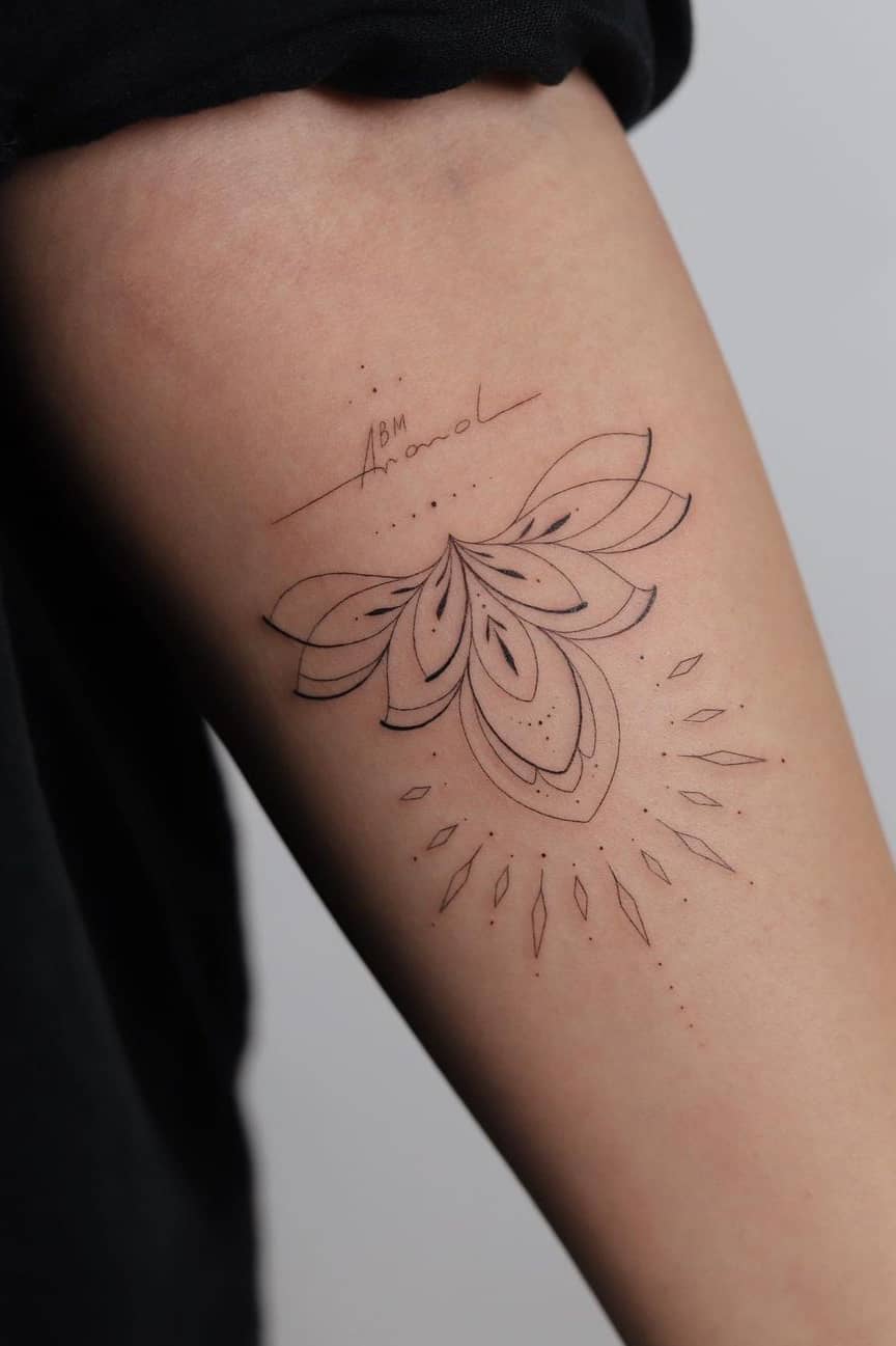 Lotus tattoo with name