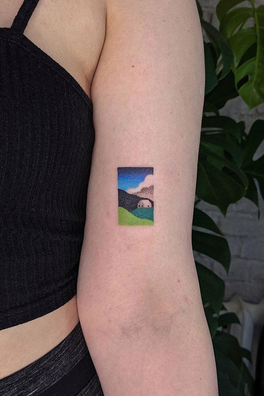 Tiny colorful landscape tattoo