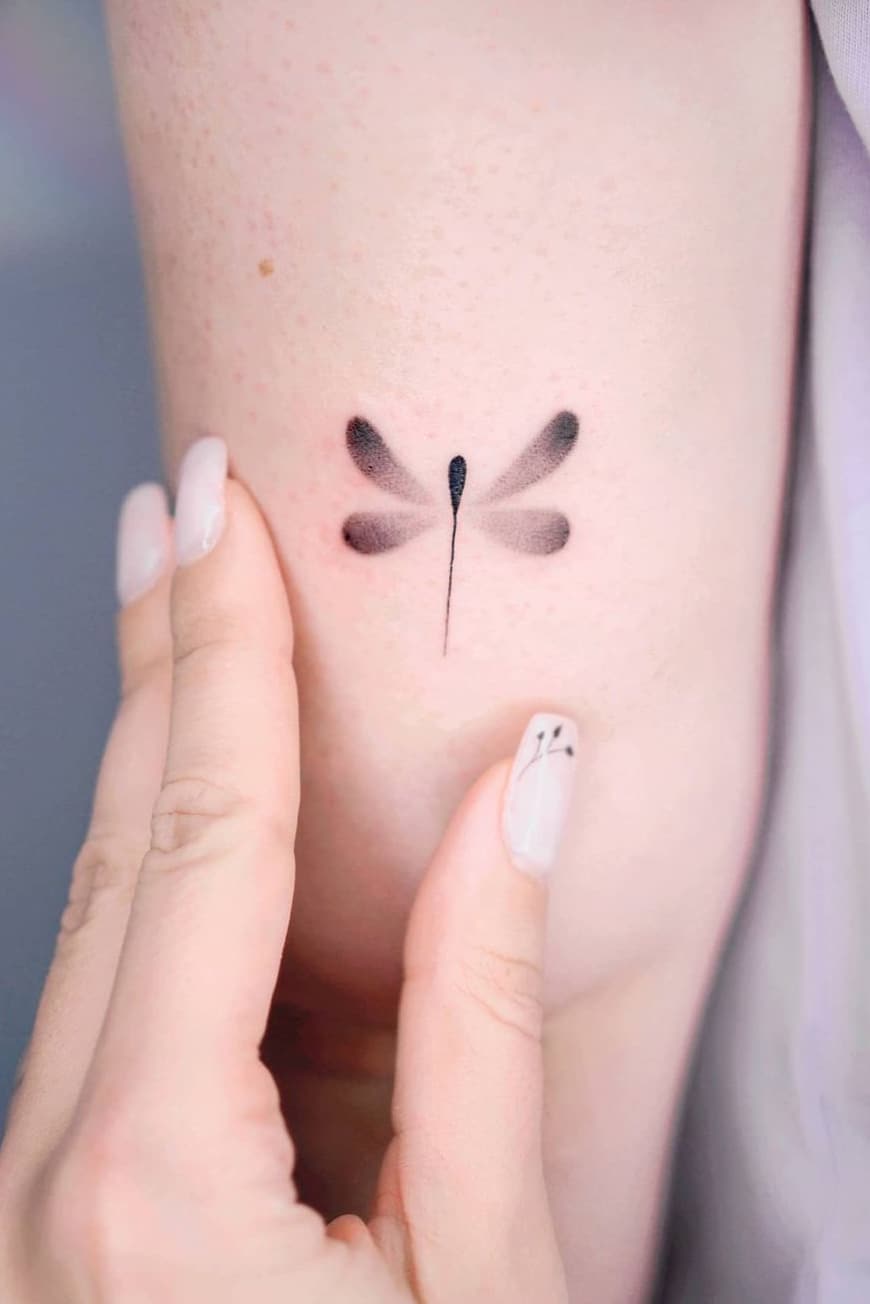 Tiny dragonfly tattoo