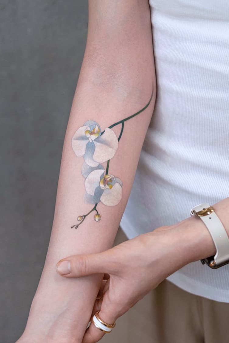 White realistic flower tattoo