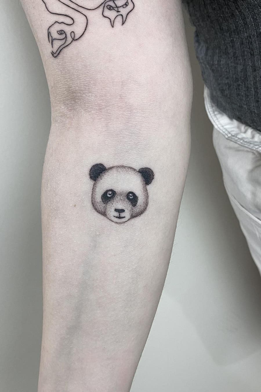 Panda face tattoo