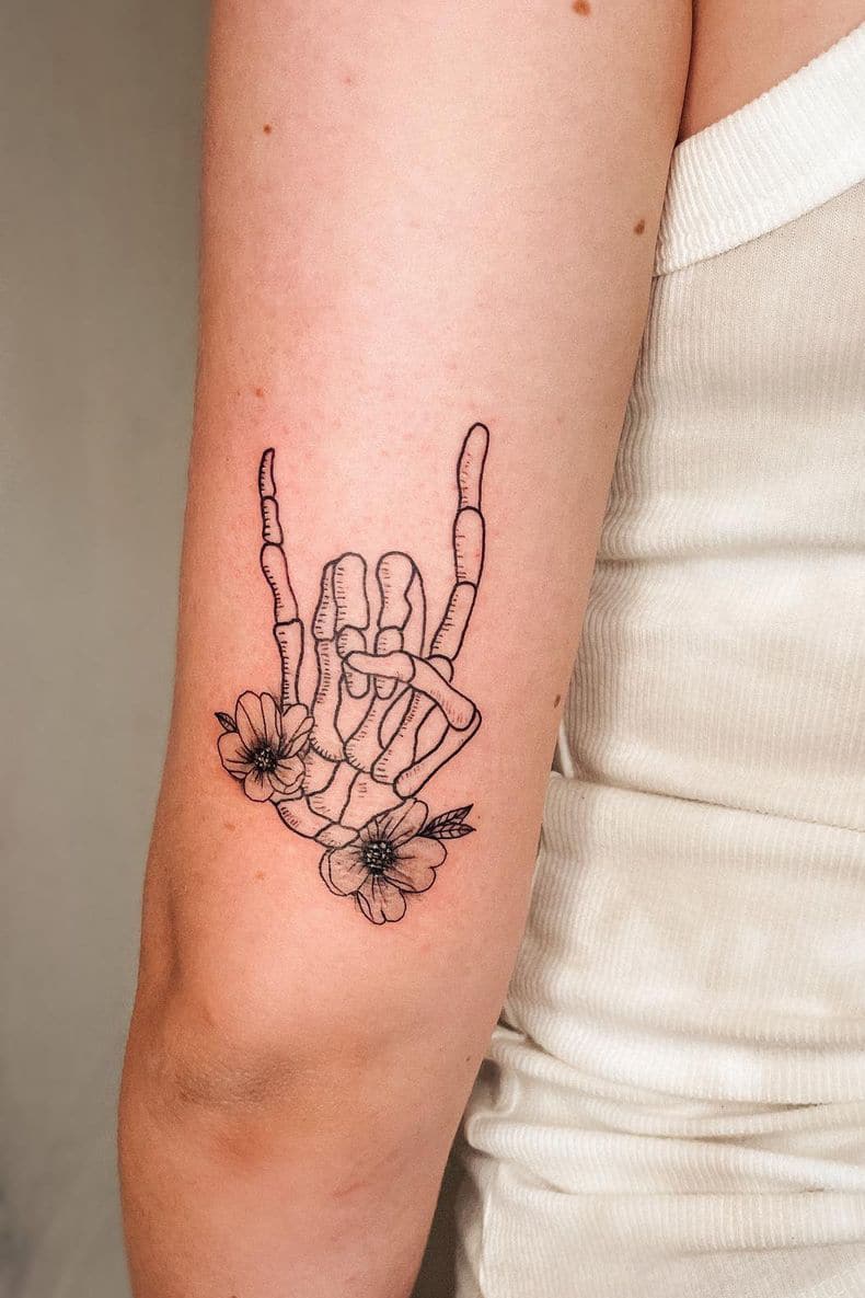 Skull hand tattoo