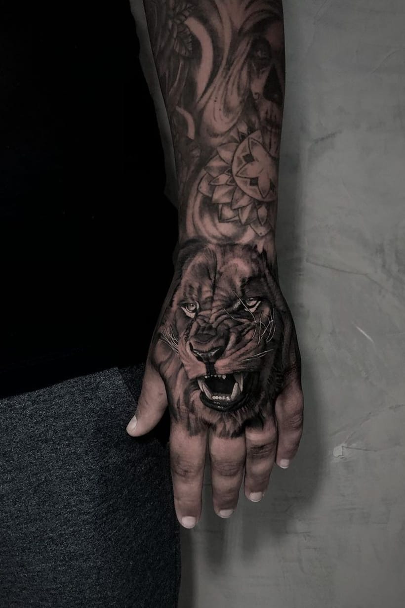 Lion tattoo on hand