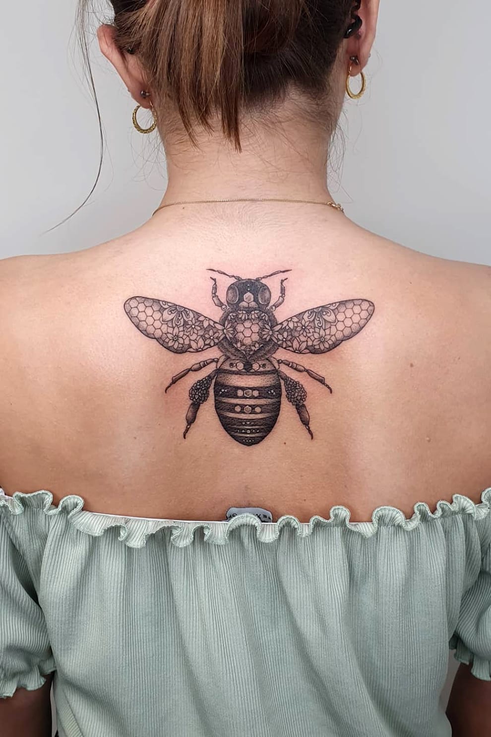 Bee tattoo on back-1