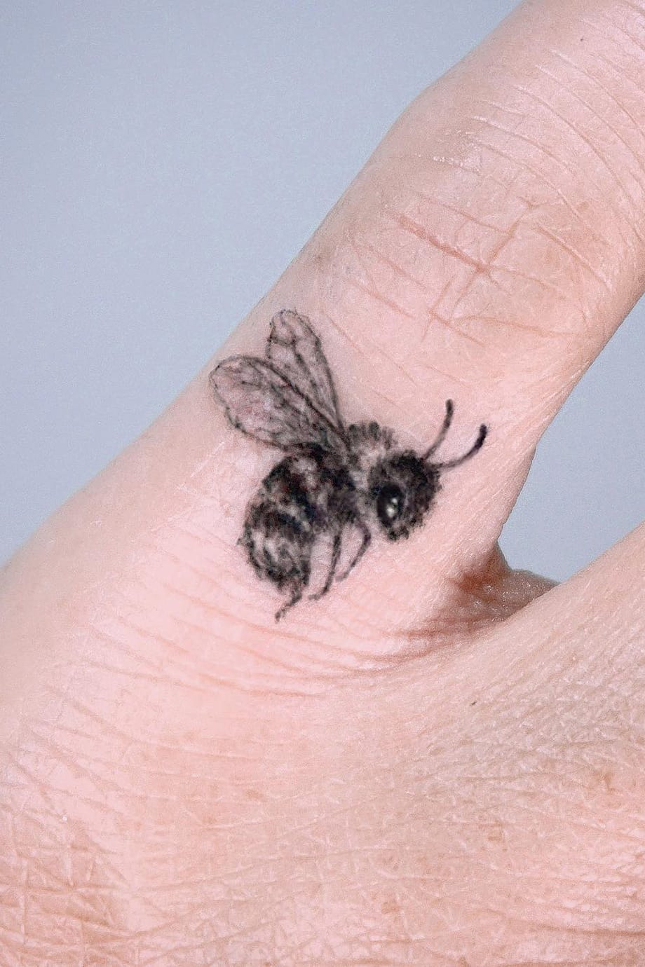 Bee tattoo on finger-1