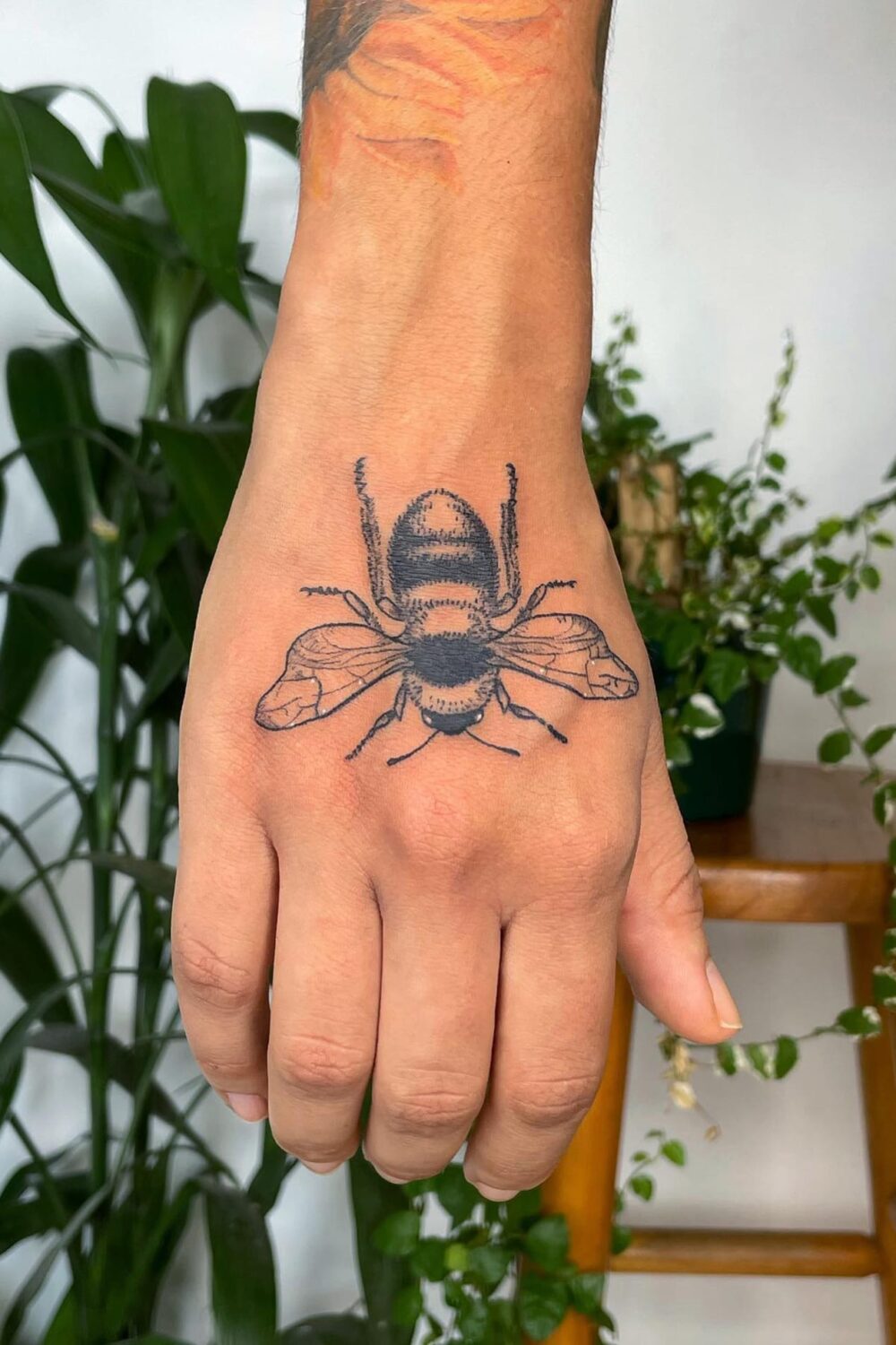 Bee tattoo on hand-2