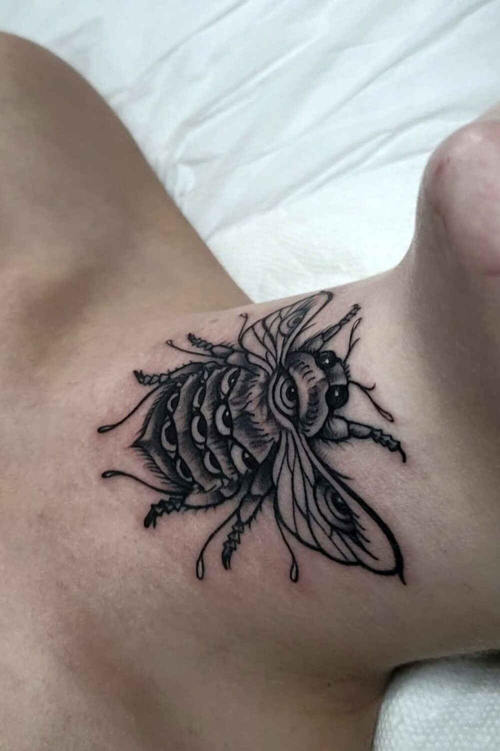 Bee tattoo on neck-1