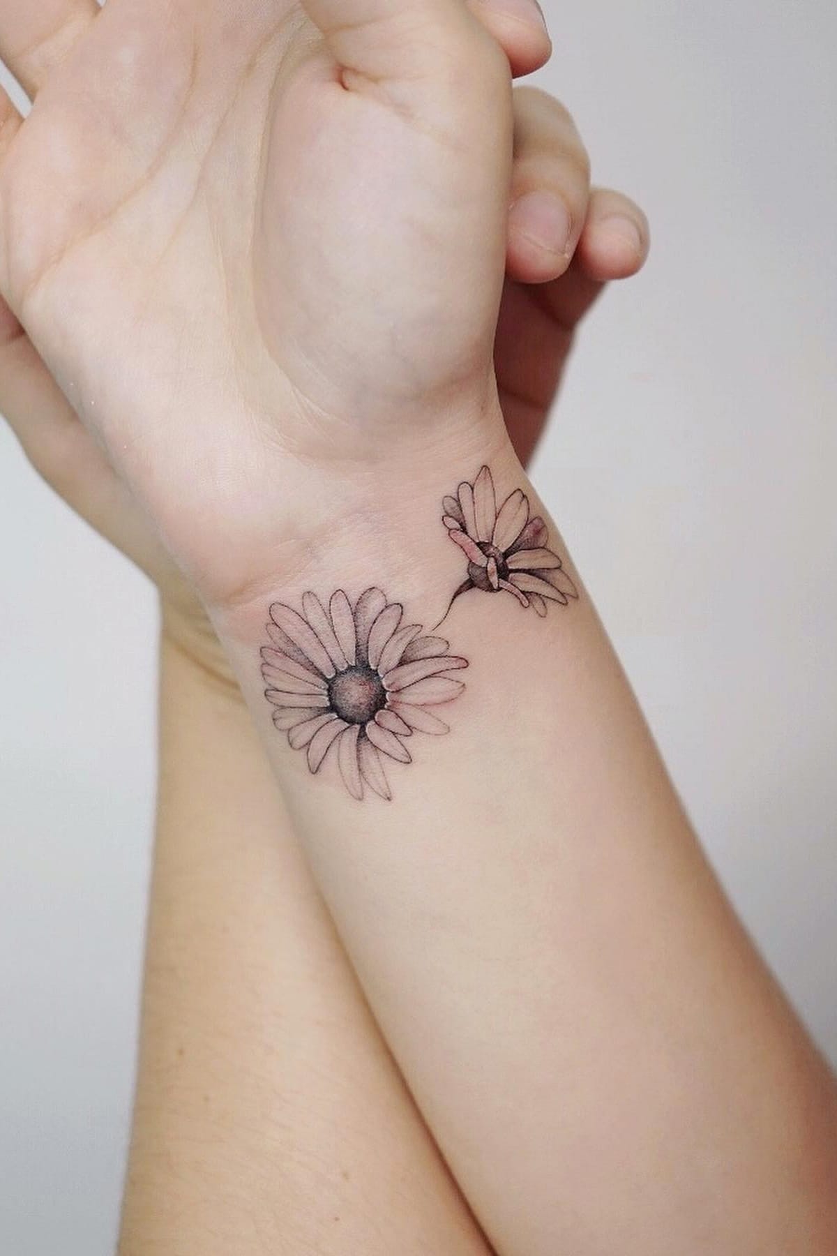 Daisy tattoo wrist