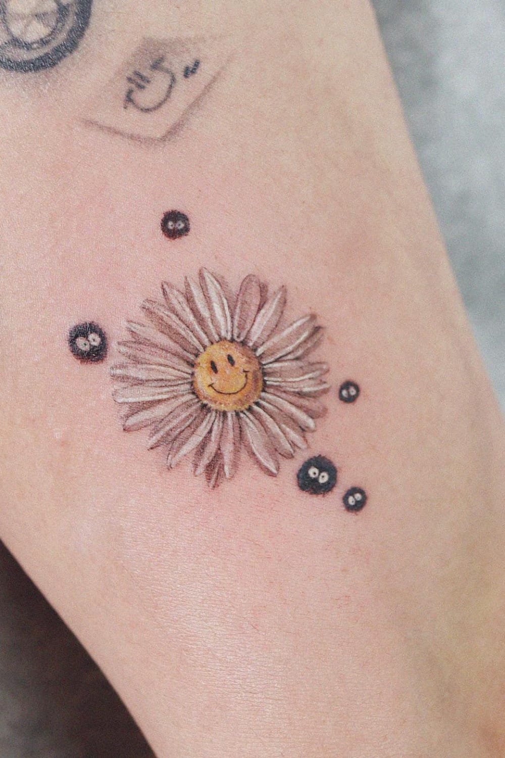 Smiley Daisy Tattoo