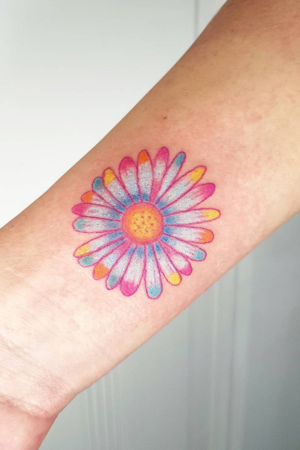 colorful daisy tattoo