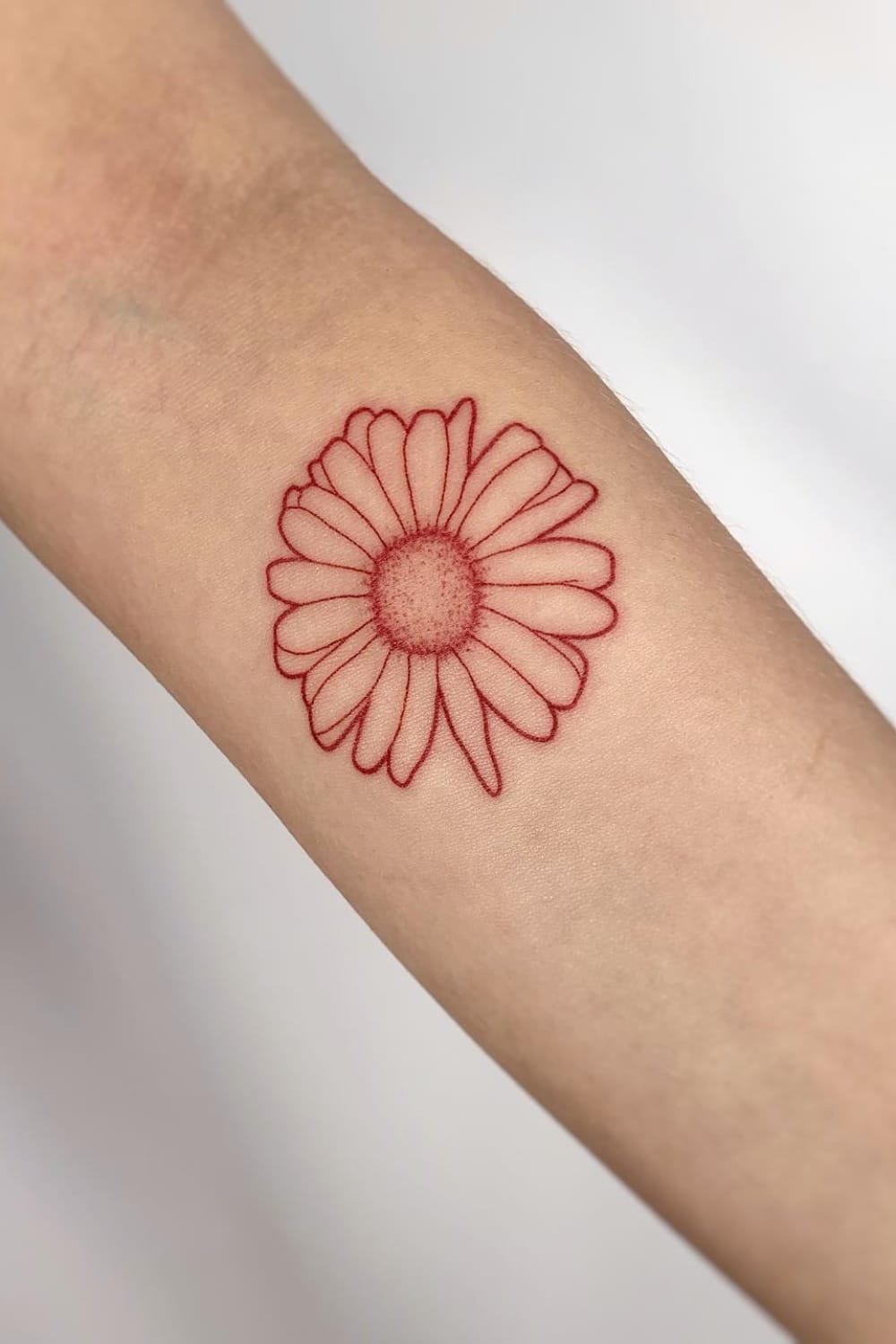 red daisy tattoo