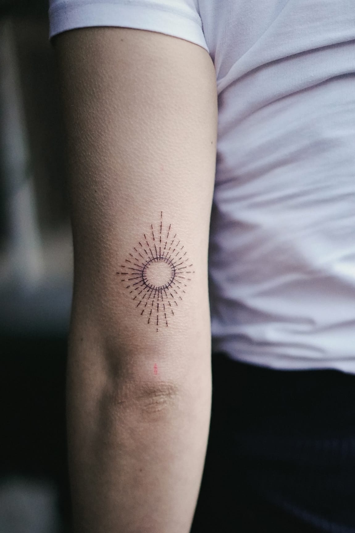 Geometric sun tattoo