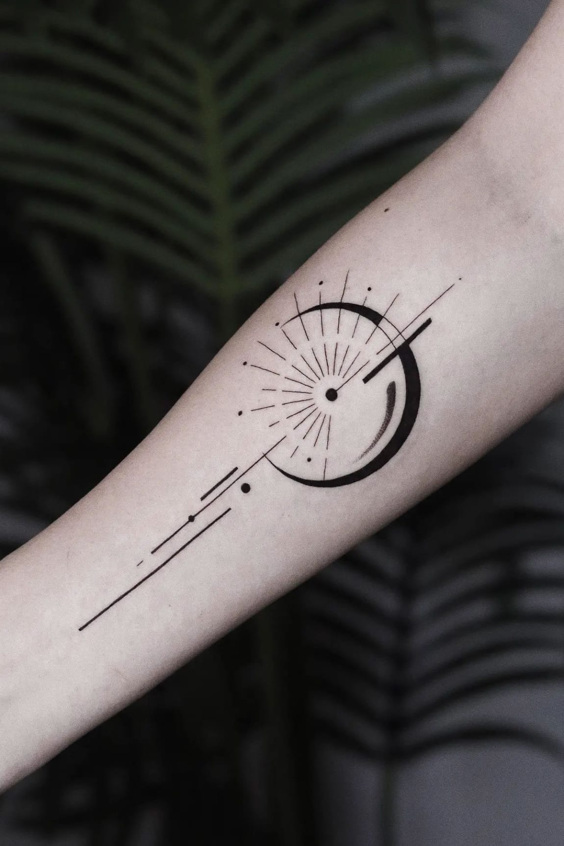 Geometric sun tattoo