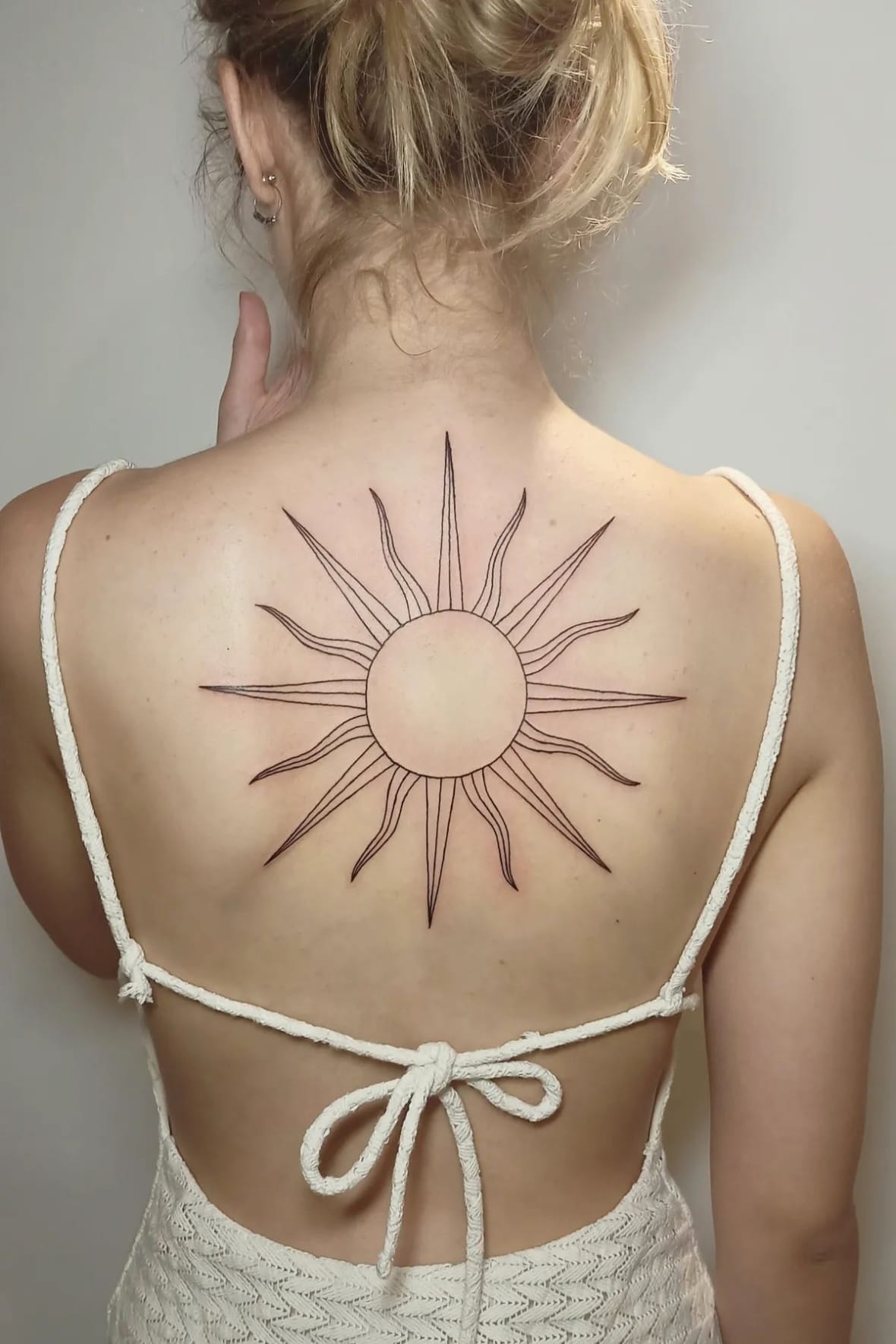 Simple sun tattoo