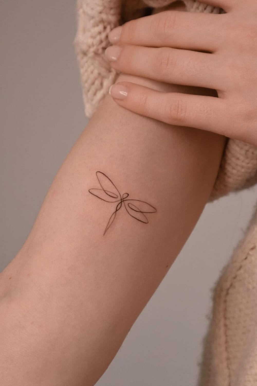 Minimalist Dragonfly Tattoo