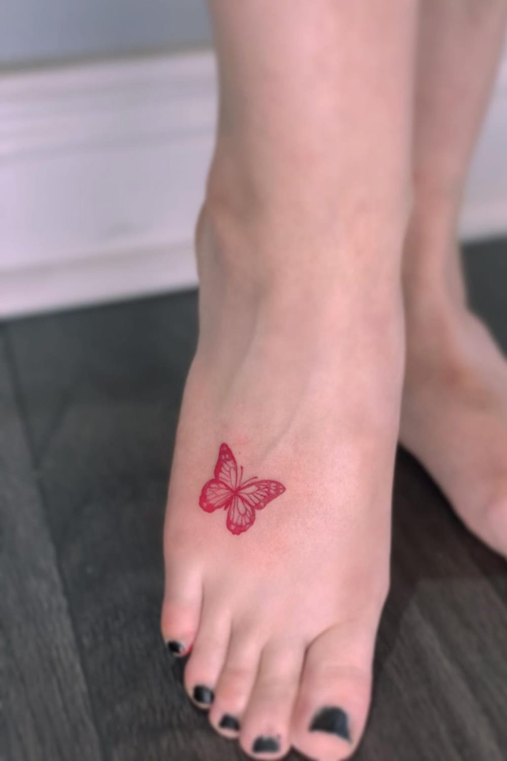 Red Butterfly Tattoo On Foot