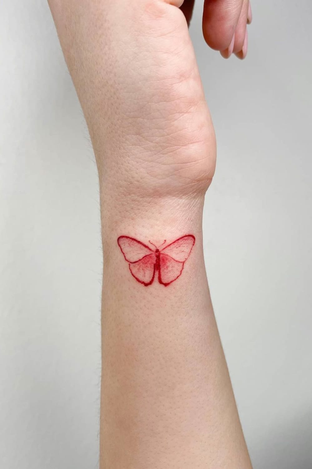 Red Butterfly Tattoo On Wrist