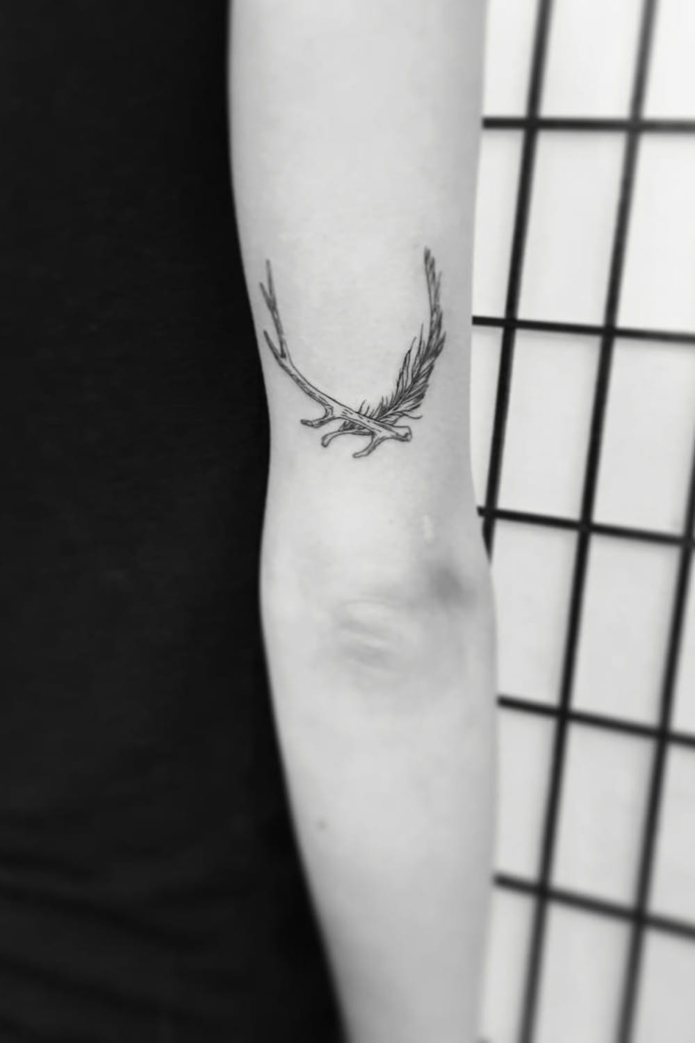 Antler and Feather Tattoo