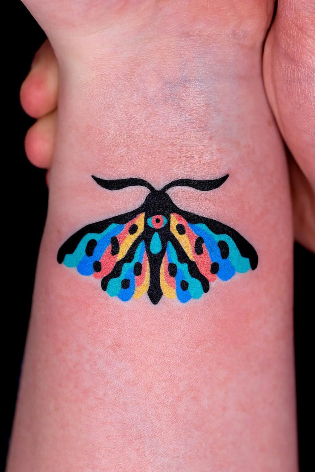 Bold and Colorful Moth Tattoo