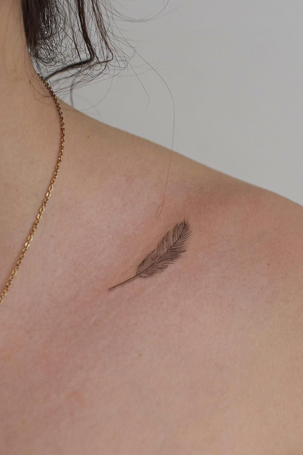 Feather Tattoo on Collarbone