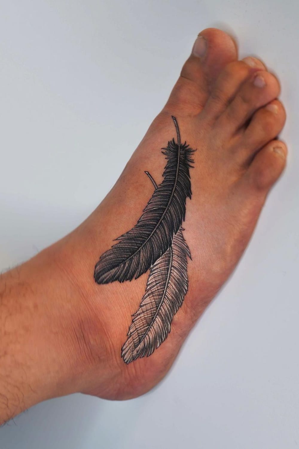 Feather tattoo on the foot