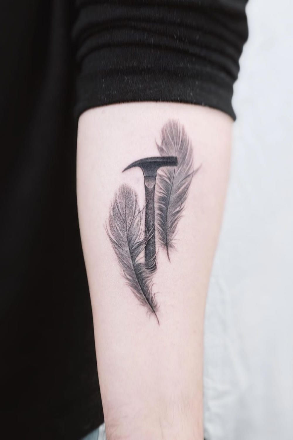 Hammer and Feather Tattoo