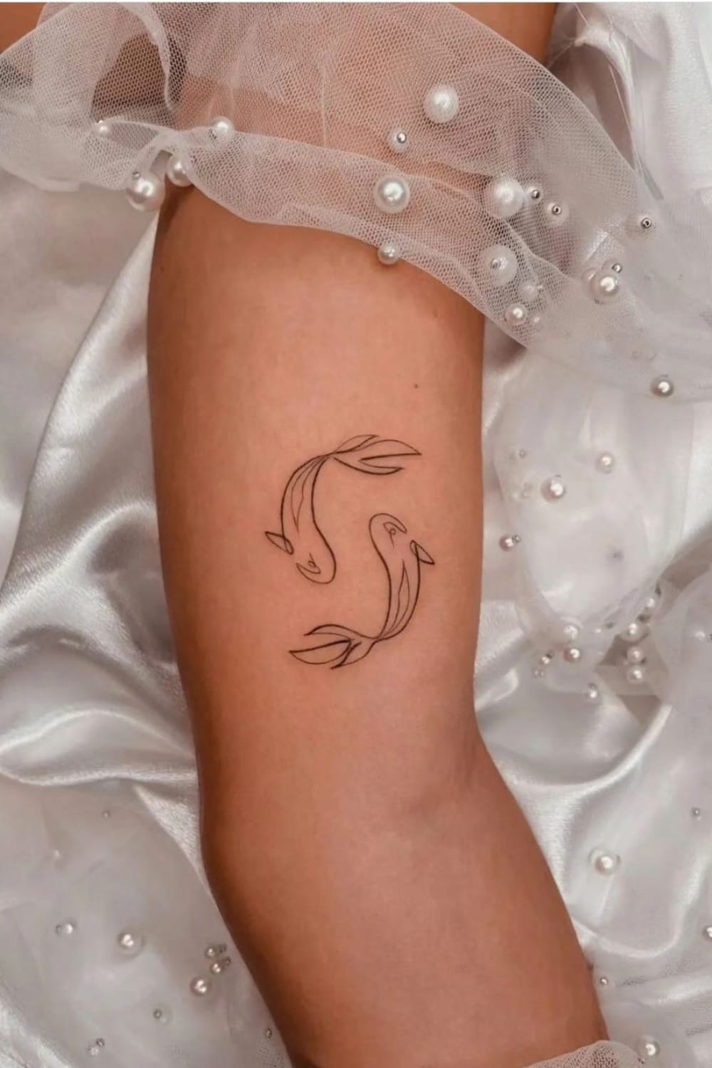 Minimalist Koi Fish Tattoo