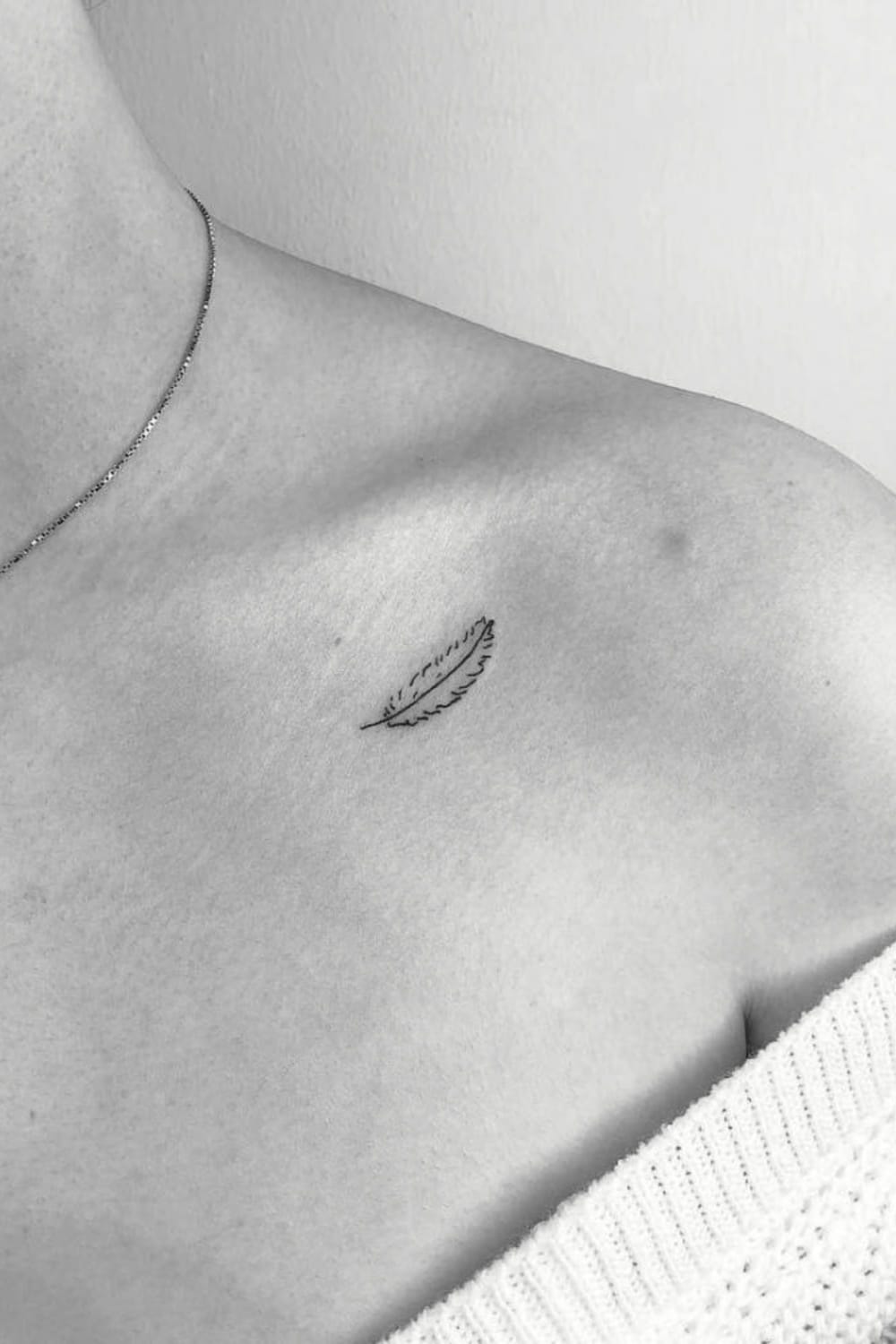 Tiny Feather Tattoo