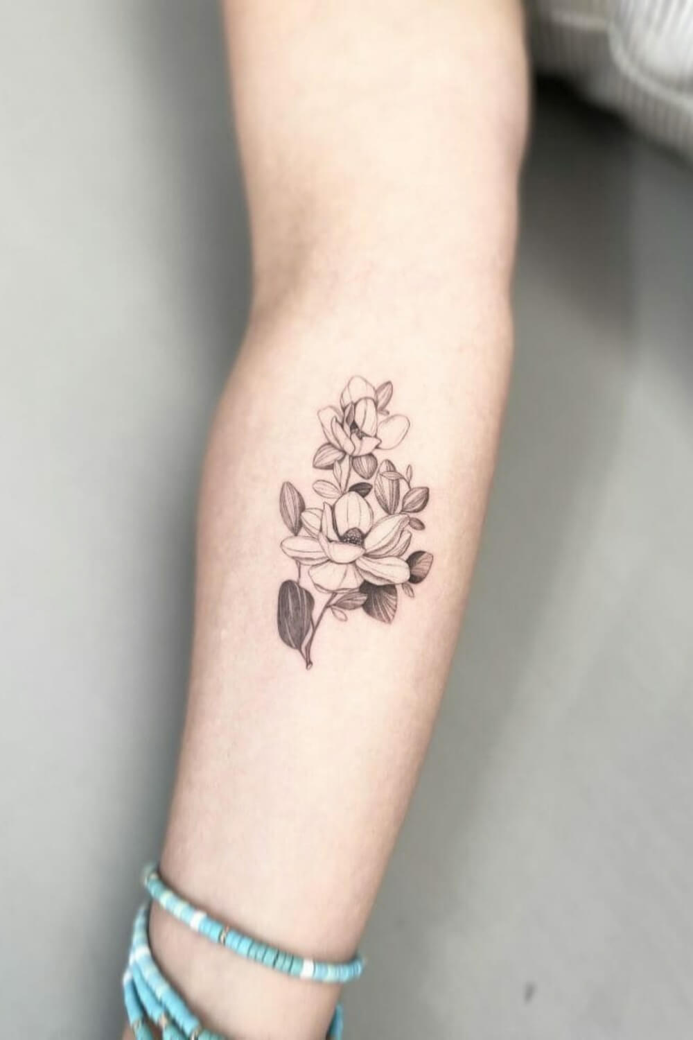 Delicate Magnolia Tattoo