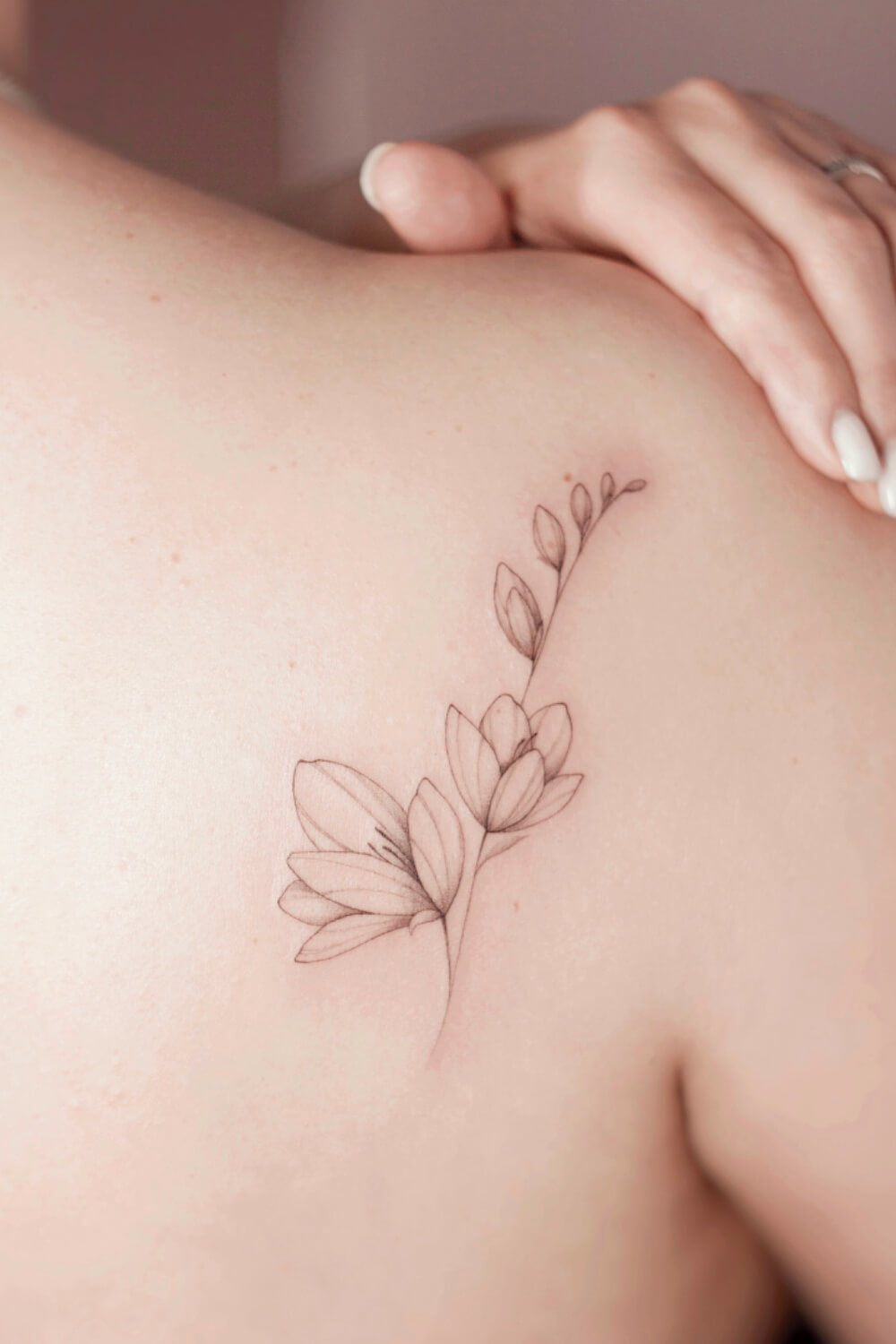 Fine Line Magnolia Tattoo